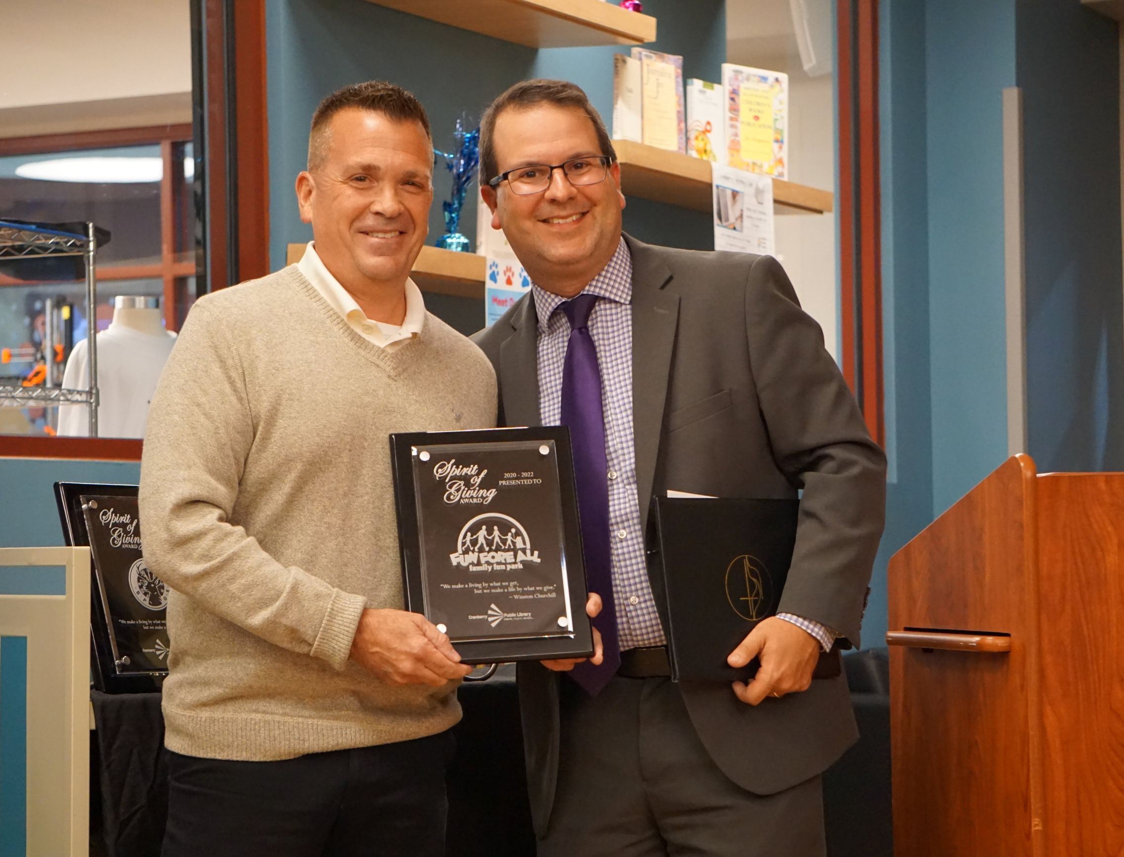 Image of Chris Camp of Fun-Fore-All accepting the Mazzoni Spirit of Giving Award